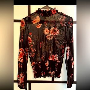 Sheer black top with ruffle collar